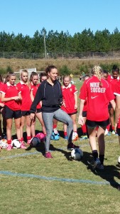 Lauren Holiday showing ball role drills to Atlanta Fire United girls. 