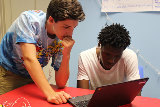 Devon Haller and Calvin Walden research for Breaking News Day, where VMCers were tasked with finding a topical subject and completing a story on it before the end of the day.